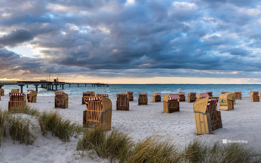 Beach chairs in front of the pier on Steinwarder in Heiligenhafen, Schleswig-Holstein, Germany