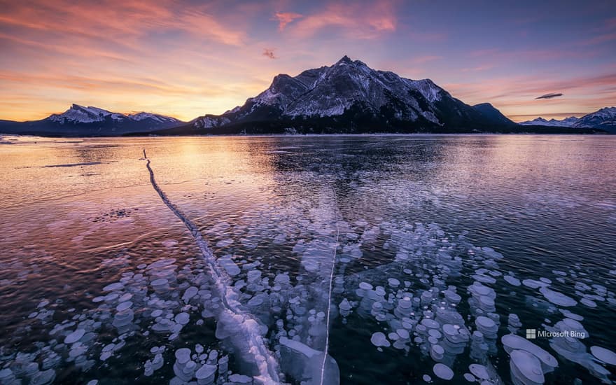 Mount Michener and a frozen Abraham Lake in Alberta, Canada