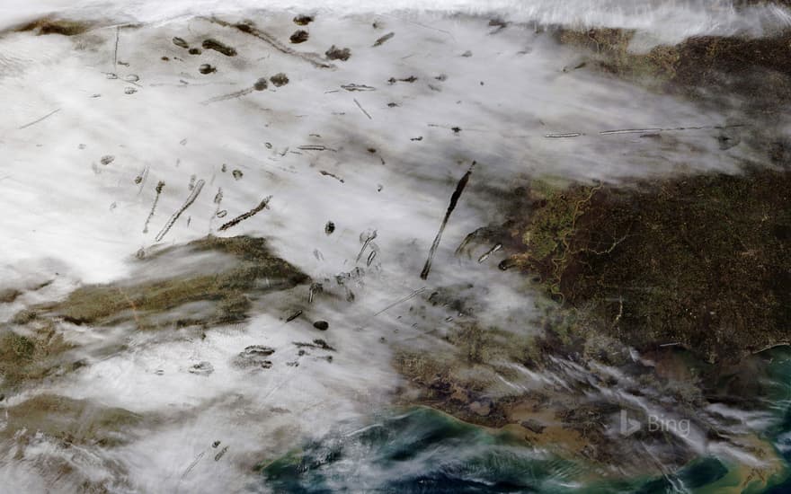 From NASA’s Terra satellite, an image of fallstreak holes in clouds over the southern United States